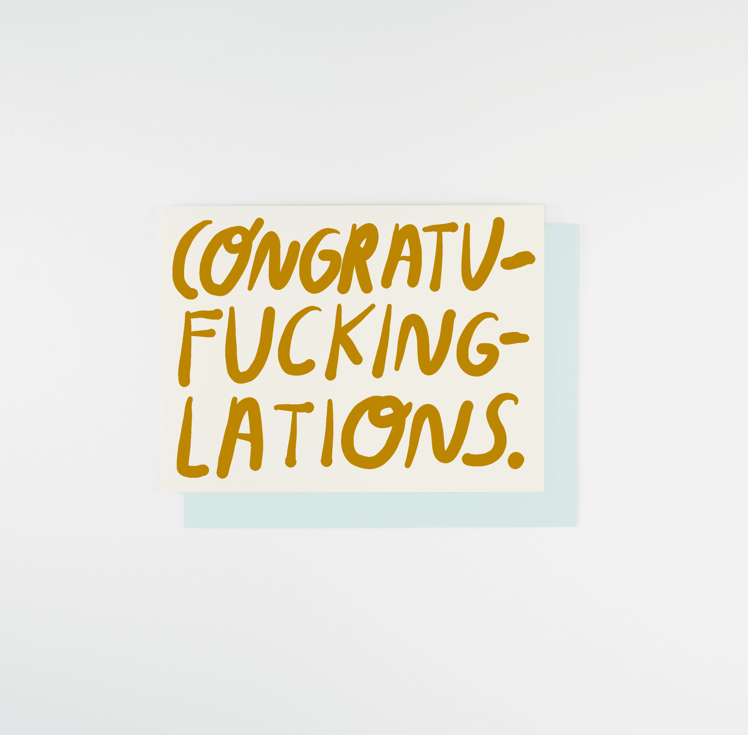 Card with yellow text 'CONGRATU-FUCKING-LATIONS' on a white background