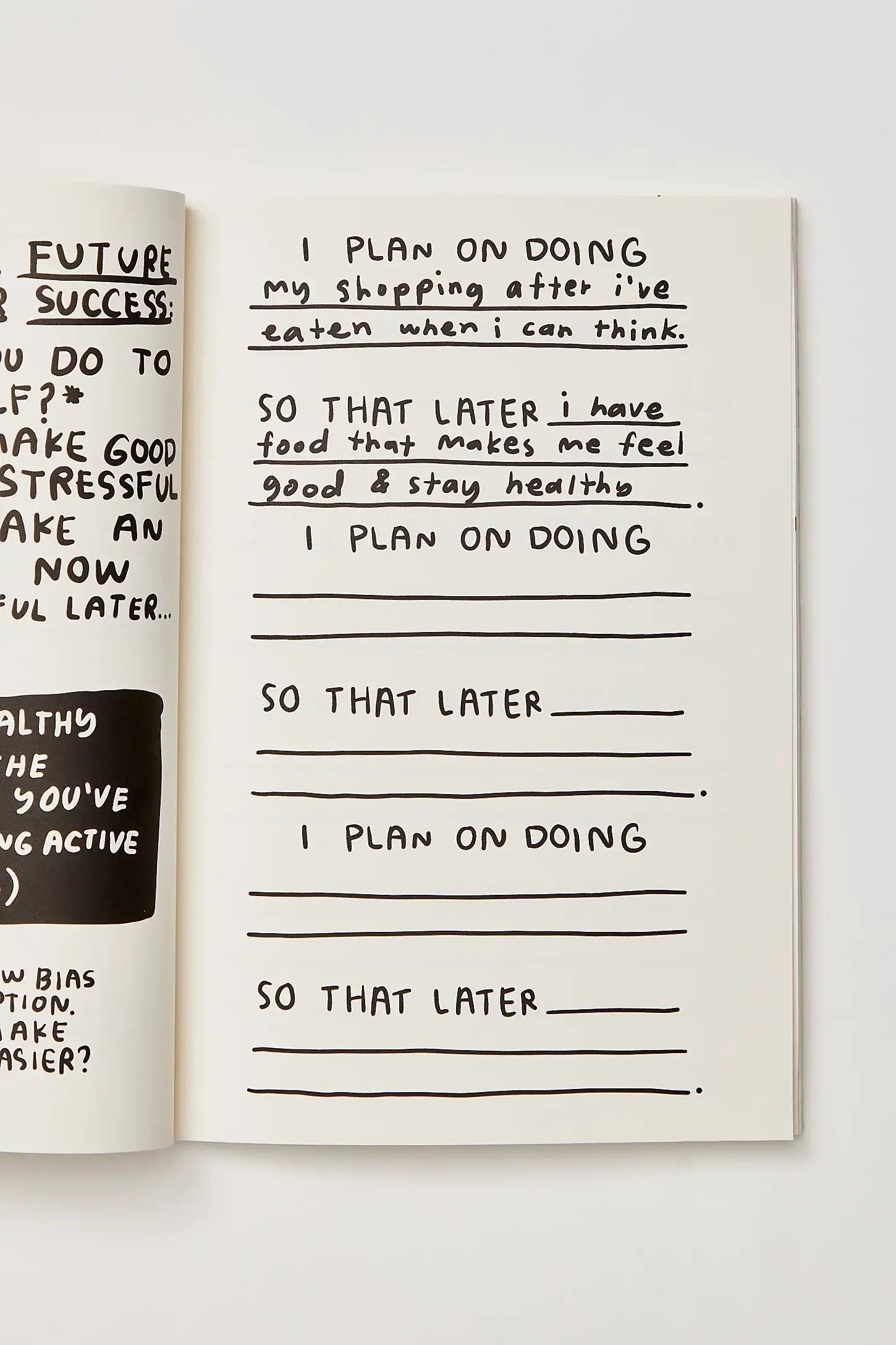 Open notebook with handwritten text on a white background