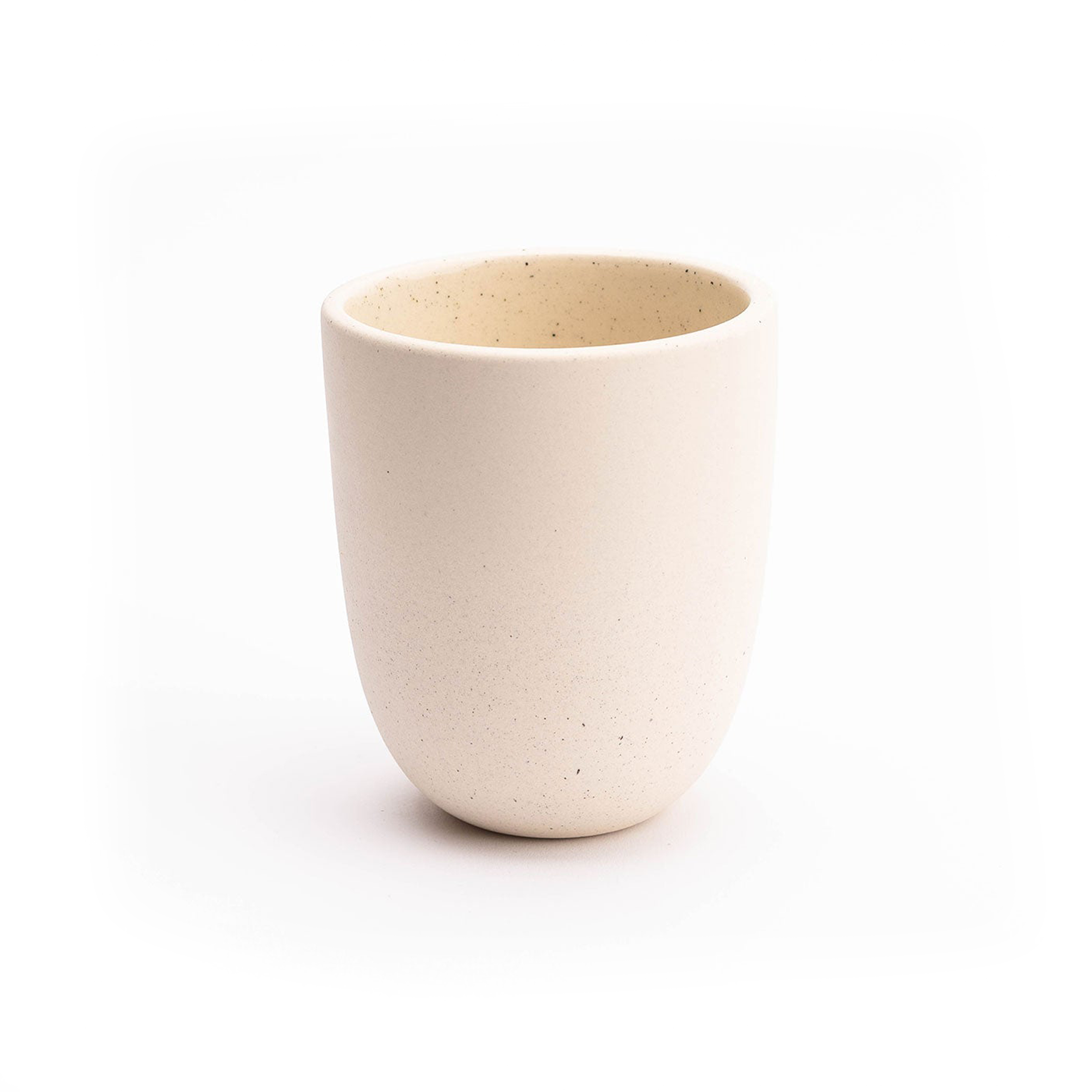 White ceramic cup on a white background