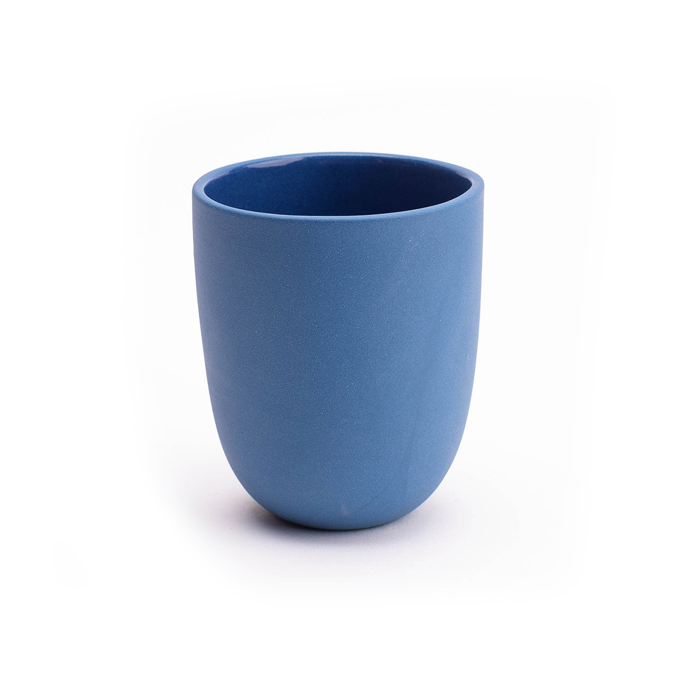 Blue ceramic cup on a white background